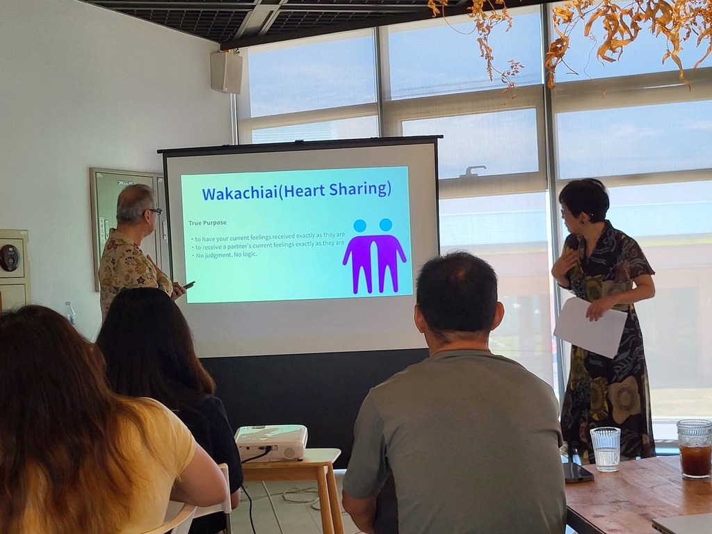Mikiko and Hidehiko presenting the Wakachiai Heart Sharing slide in Taiwan